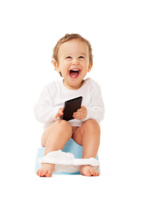 Laughing boy with smartphone sitting on the pot on isolated white