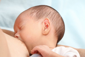 A baby boy being breastfed